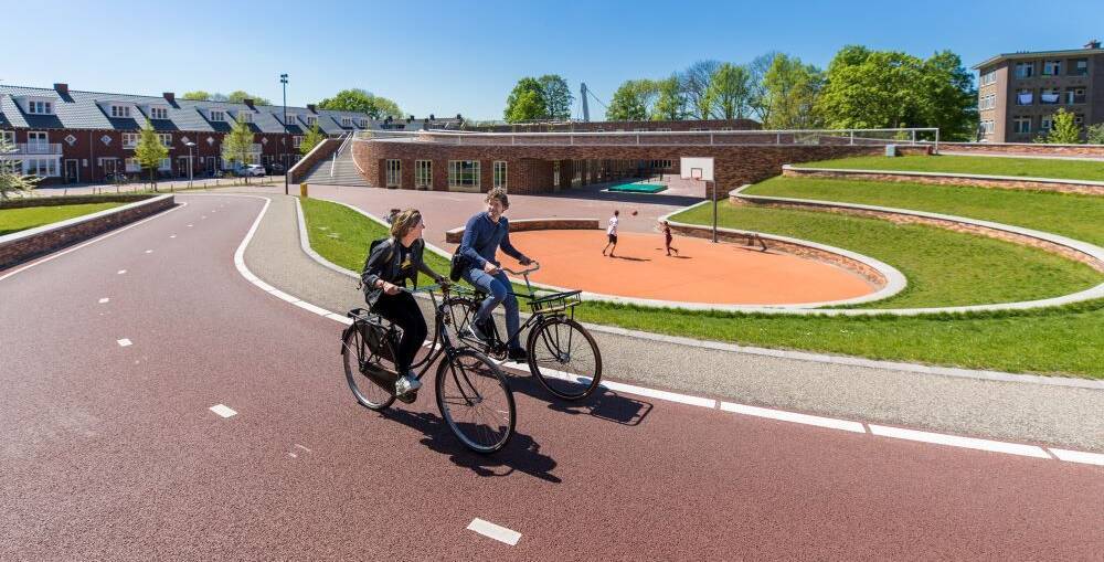 people biking on bike path in utrecht